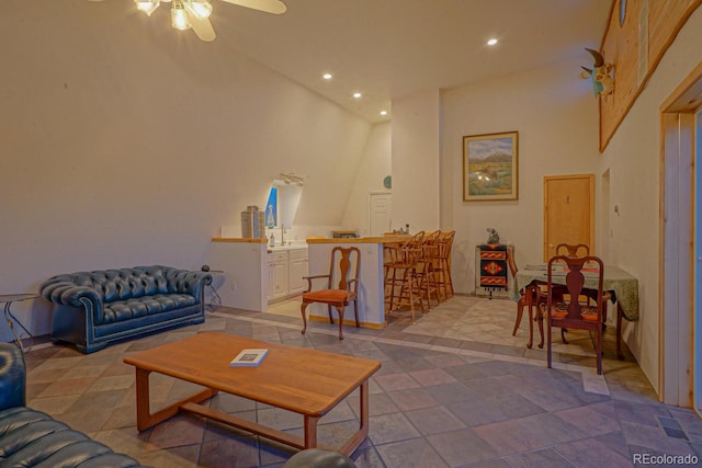 tiled living room featuring ceiling fan