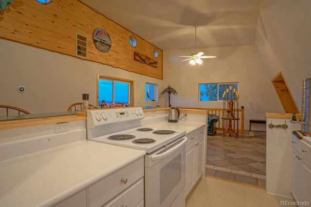 kitchen featuring white cabinetry, white range with electric stovetop, ceiling fan, and light tile floors