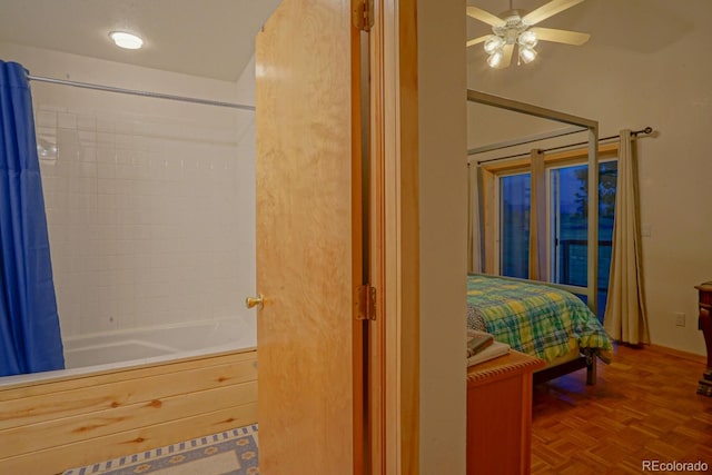 bedroom with ceiling fan and parquet floors