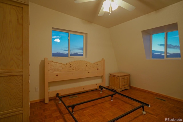 bedroom featuring dark parquet floors and ceiling fan