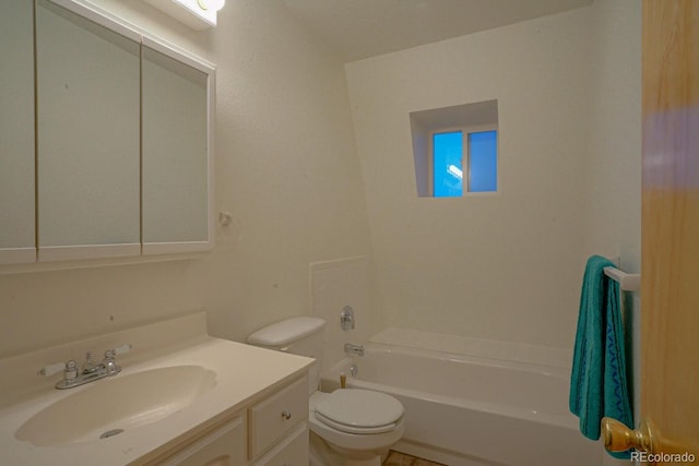 bathroom featuring toilet and vanity