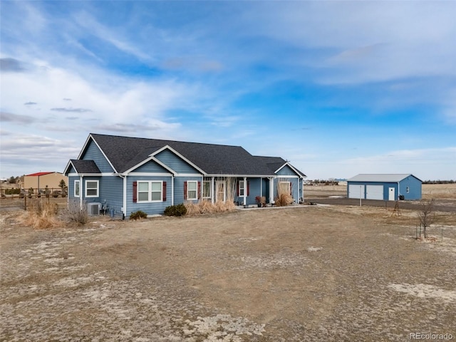 single story home featuring a garage and central AC