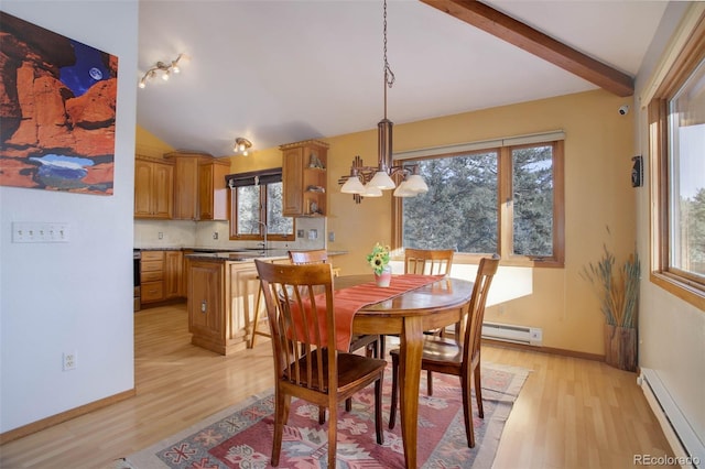 dining area with light wood-type flooring, a wealth of natural light, lofted ceiling with beams, and baseboard heating