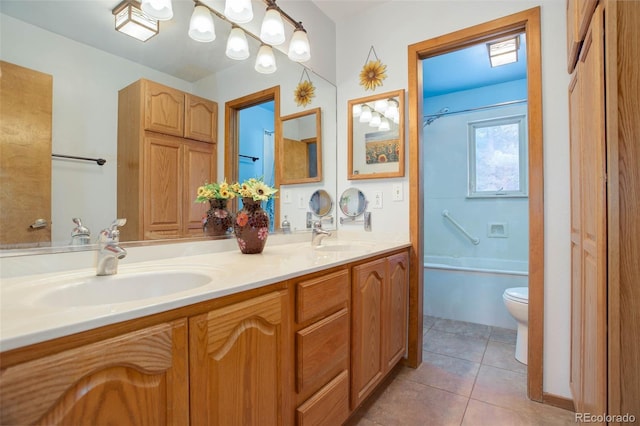 full bathroom with tile patterned flooring, vanity, shower / tub combination, and toilet