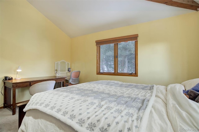 bedroom with lofted ceiling and light carpet