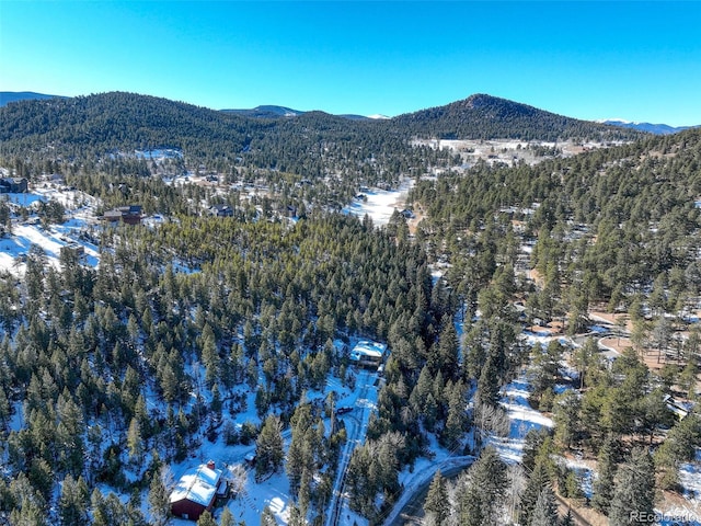 snowy aerial view with a mountain view