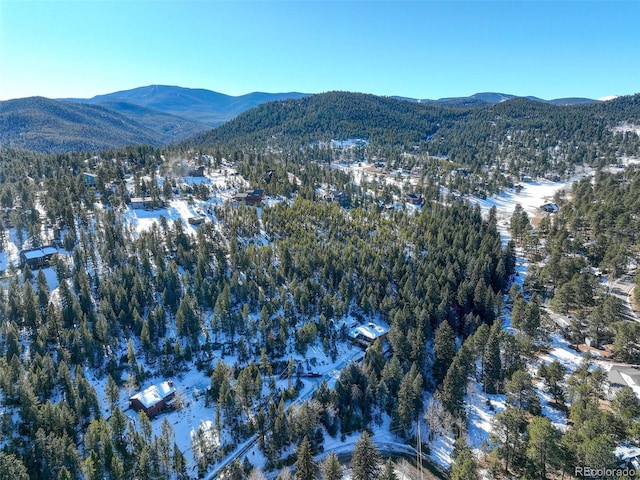 snowy aerial view featuring a mountain view