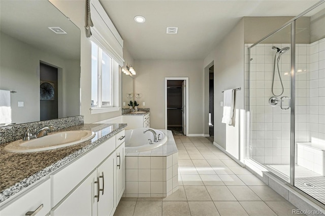 full bathroom with a shower stall, tile patterned floors, visible vents, and a sink