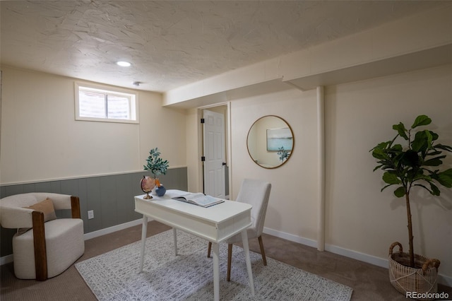 office featuring carpet floors and a textured ceiling