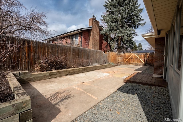 view of patio with a gate and a fenced backyard