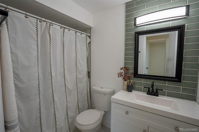 full bath with toilet, backsplash, and vanity