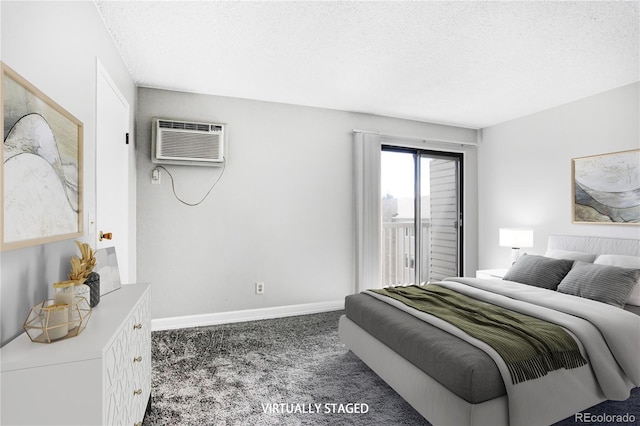 381 S Ames St Unit E305, Lakewood, CO 80226 - carpeted bedroom with a textured ceiling, baseboards, access to exterior, and a wall unit AC