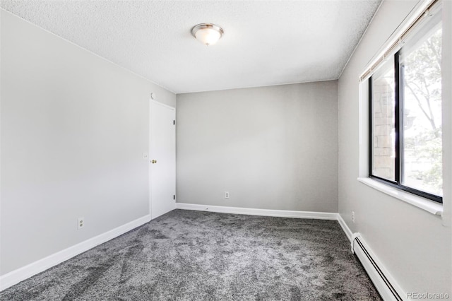 381 S Ames St Unit E305, Lakewood, CO 80226 - unfurnished room with a baseboard heating unit, carpet flooring, and a textured ceiling