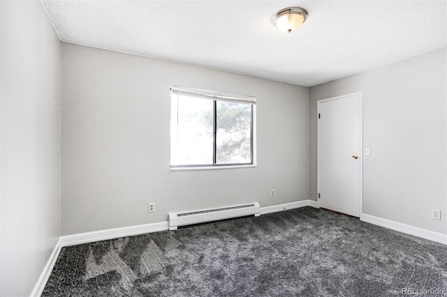 381 S Ames St Unit E305, Lakewood, CO 80226 - empty room featuring baseboard heating, baseboards, dark carpet, and a textured ceiling