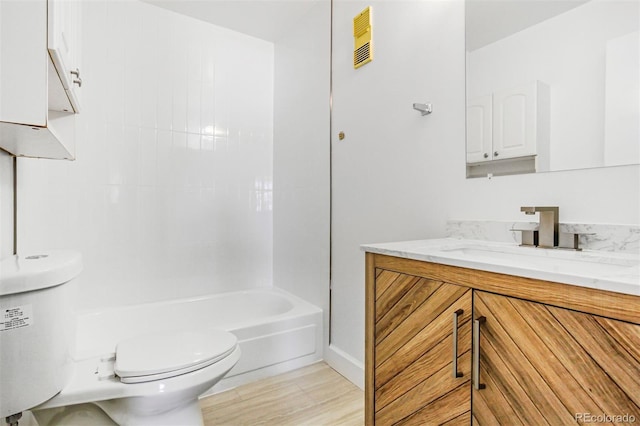 381 S Ames St Unit E305, Lakewood, CO 80226 - full bath with toilet, vanity, baseboards, visible vents, and bathing tub / shower combination