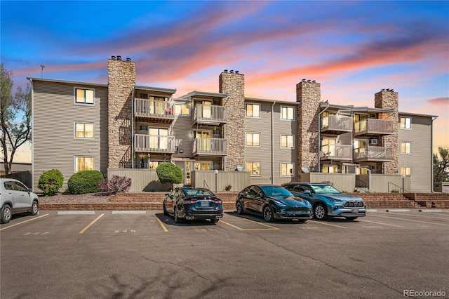 381 S Ames St Unit E305, Lakewood, CO 80226 - property at dusk with uncovered parking