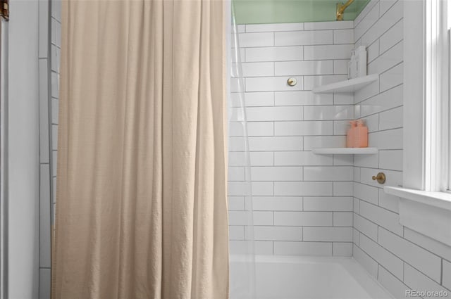 bathroom with shower / bathtub combination with curtain