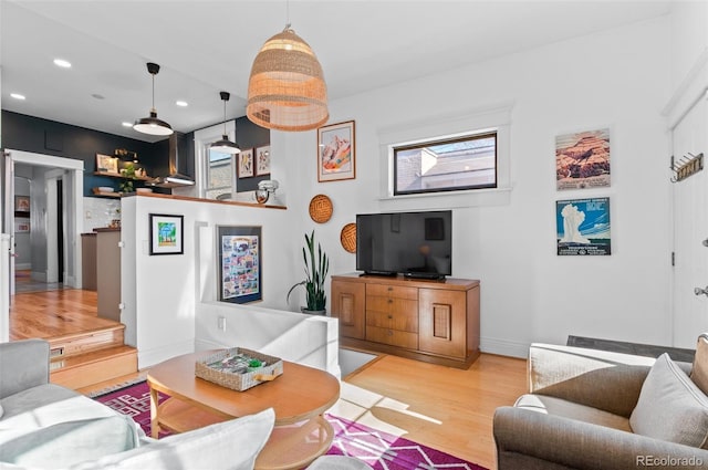 living room with light hardwood / wood-style flooring and plenty of natural light