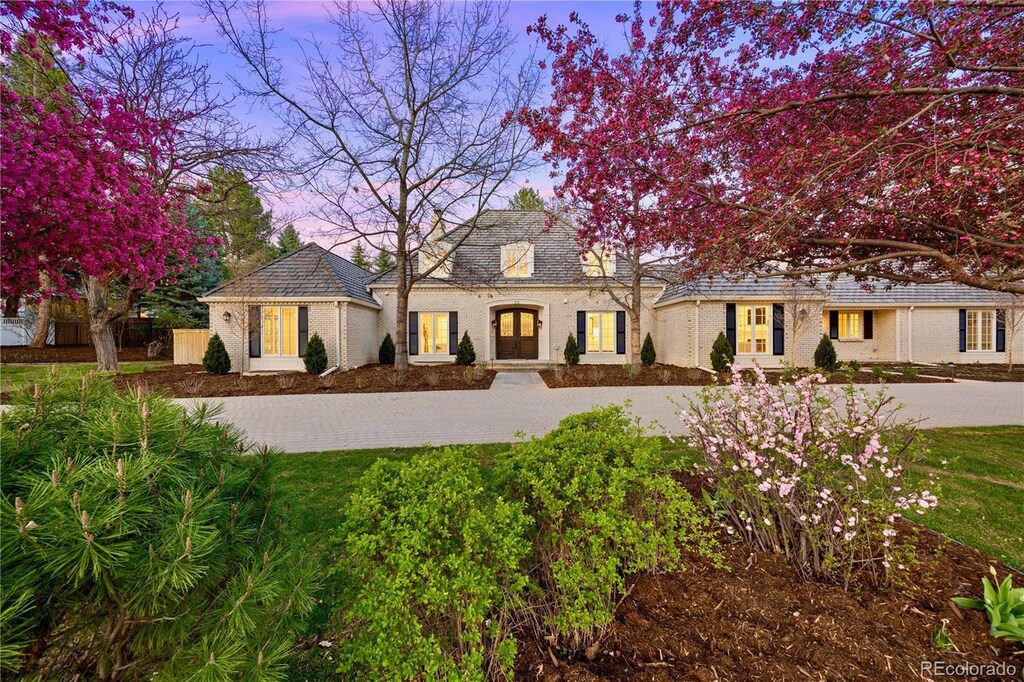 38 Sedgwick Dr, Cherry Hills Village, CO 80113 - view of front of home featuring a front yard and driveway