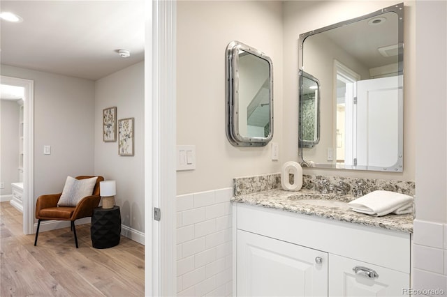 bathroom featuring vanity and wood finished floors