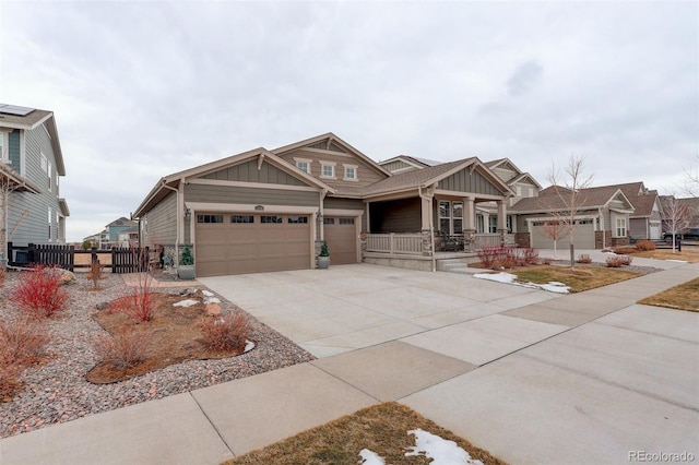 craftsman house with a garage and covered porch