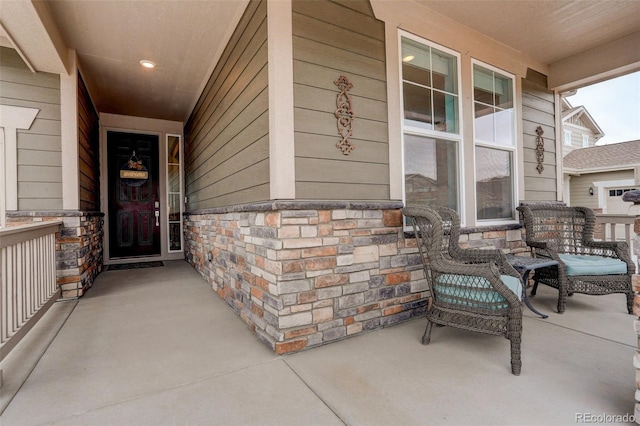 view of exterior entry featuring a porch