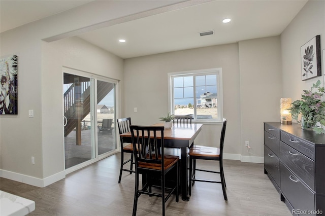 dining area with light hardwood / wood-style flooring