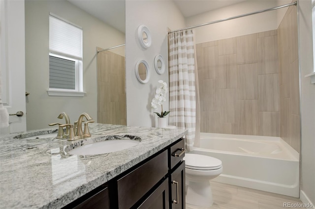 full bathroom featuring vanity, shower / bath combination with curtain, and toilet