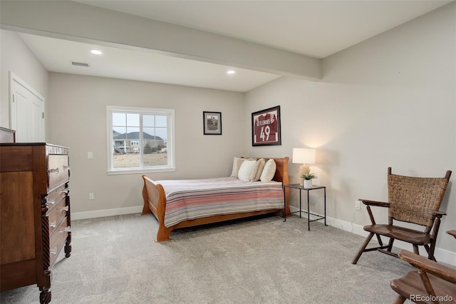 bedroom with light carpet and beam ceiling