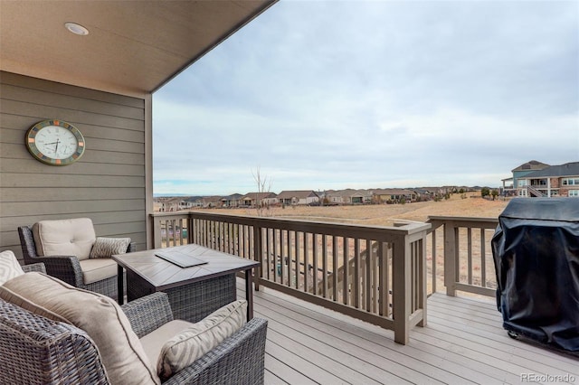 deck featuring area for grilling and outdoor lounge area