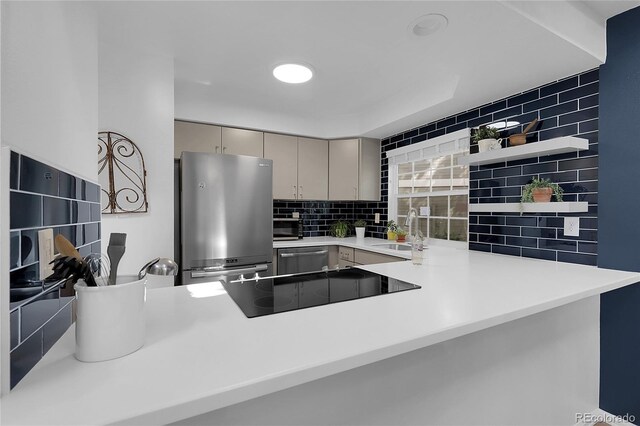 2021 S Hannibal Way Unit F, Aurora, CO 80013 - kitchen featuring appliances with stainless steel finishes, backsplash, a peninsula, open shelves, and gray cabinets