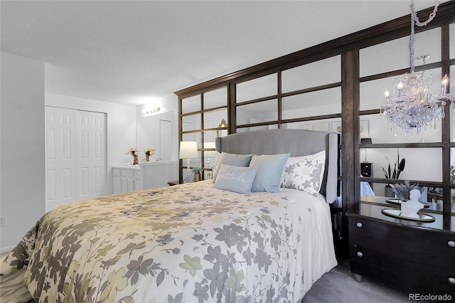 2021 S Hannibal Way Unit F, Aurora, CO 80013 - bedroom featuring a chandelier and carpet flooring