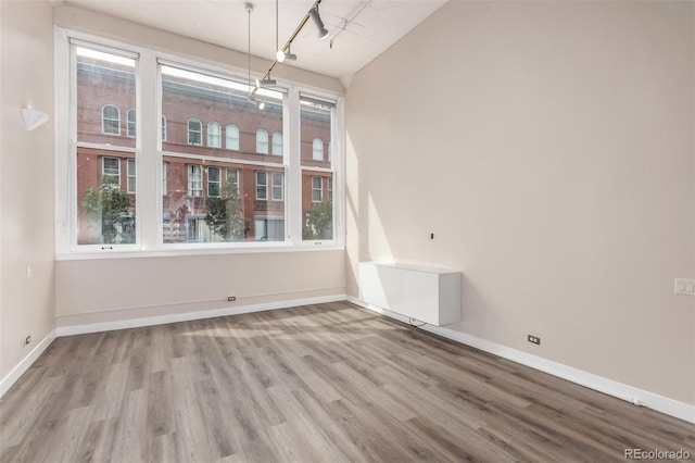 720 16th St Unit 207, Denver, CO 80202 - unfurnished dining area with wood finished floors and vaulted ceiling