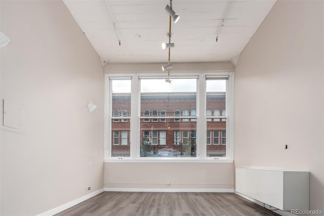 720 16th St Unit 207, Denver, CO 80202 - spare room with wood finished floors and rail lighting