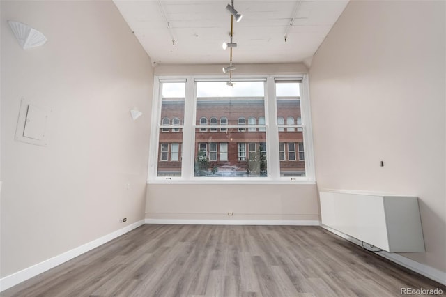 720 16th St Unit 207, Denver, CO 80202 - unfurnished room featuring rail lighting and wood finished floors