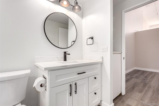720 16th St Unit 207, Denver, CO 80202 - bathroom featuring vanity and wood finished floors
