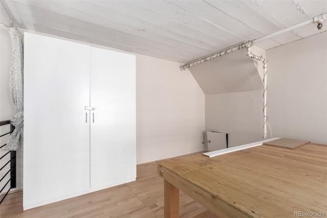 720 16th St Unit 207, Denver, CO 80202 - additional living space with wood finished floors and vaulted ceiling
