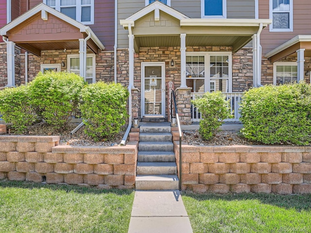 13638 Garfield St Unit C, Thornton, CO 80602 - view of exterior entry featuring stone siding