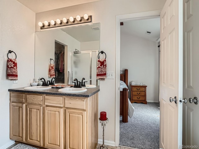 13638 Garfield St Unit C, Thornton, CO 80602 - full bath featuring a stall shower, double vanity, ensuite bathroom, and baseboards