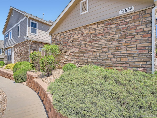 13638 Garfield St Unit C, Thornton, CO 80602 - view of side of property with brick siding