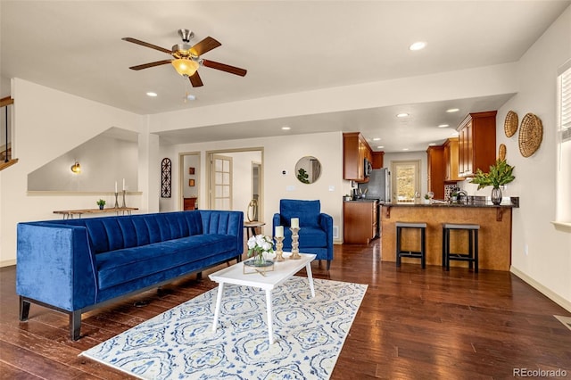 living area with ceiling fan, dark wood finished floors, and recessed lighting