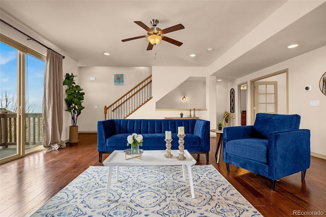living area featuring wood finished floors, recessed lighting, a ceiling fan, and stairs