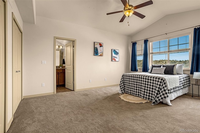 carpeted bedroom with baseboards, ceiling fan, ensuite bath, and lofted ceiling