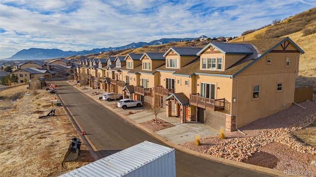 view of street featuring a mountain view and a residential view