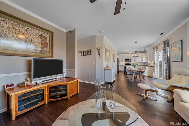 living room featuring sink, ornamental molding, dark hardwood / wood-style flooring, and ceiling fan with notable chandelier