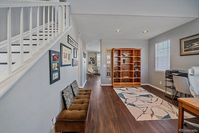 home office with dark hardwood / wood-style flooring