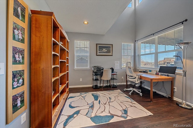 office space with dark hardwood / wood-style floors and a textured ceiling