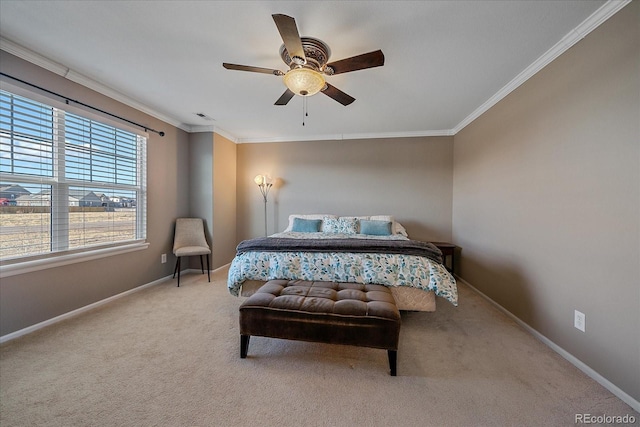 bedroom with crown molding, light colored carpet, and ceiling fan