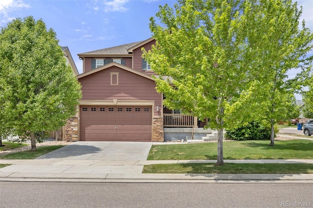 3535 Raintree Ln, Dacono, CO 80514 - view of property hidden behind natural elements featuring stone siding, driveway, and a front yard