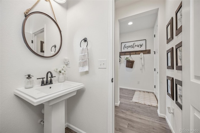 3535 Raintree Ln, Dacono, CO 80514 - bathroom with wood finished floors and recessed lighting